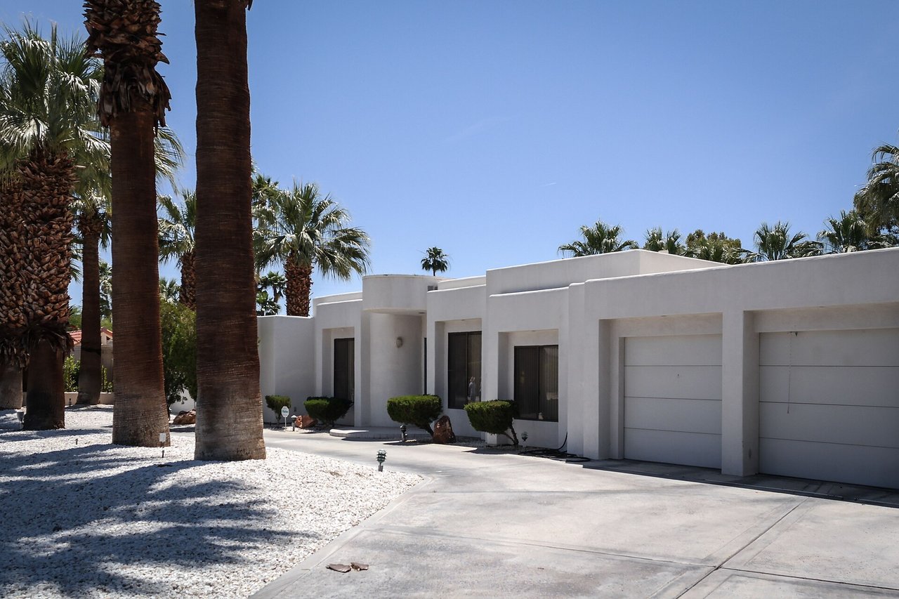 Mid-century modern home with palm trees in Palm Springs, California.