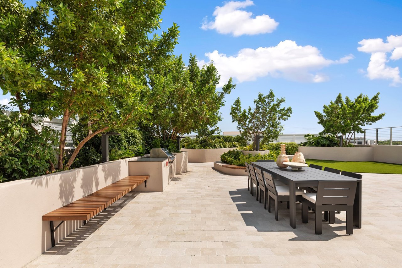Arbor Coconut Grove rooftop dining terrace surrounded by trees