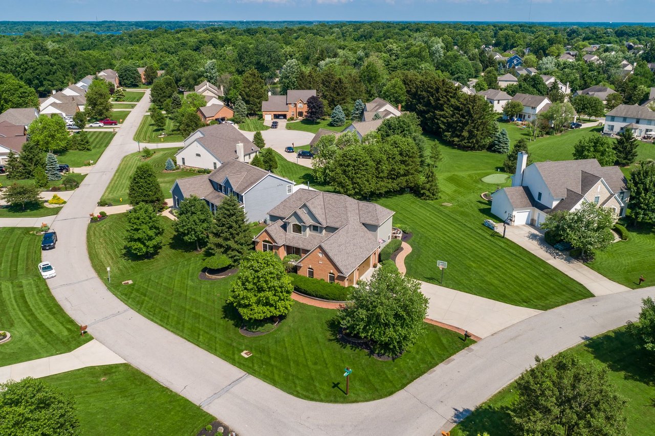 Aerial view of neighborhood showing streets, homes, yards