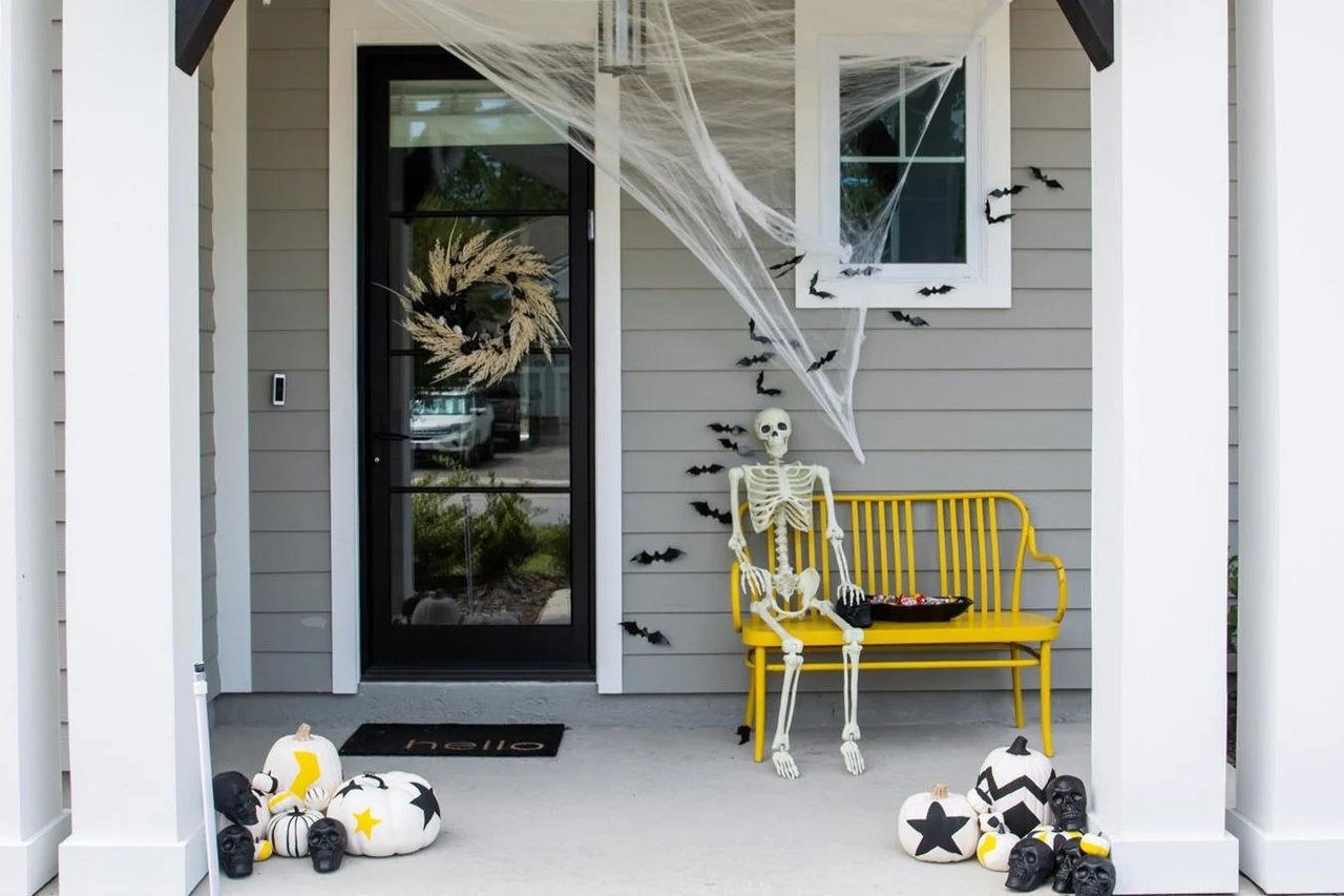 Florida home decorated for Halloween with pumpkins, skeletons, and spooky front porch decorations in Tampa Bay