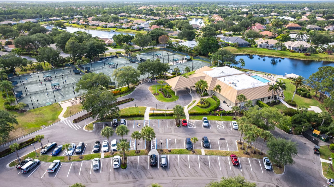 Aerial of Longshore Lake community layout with tennis center and main clubhouse