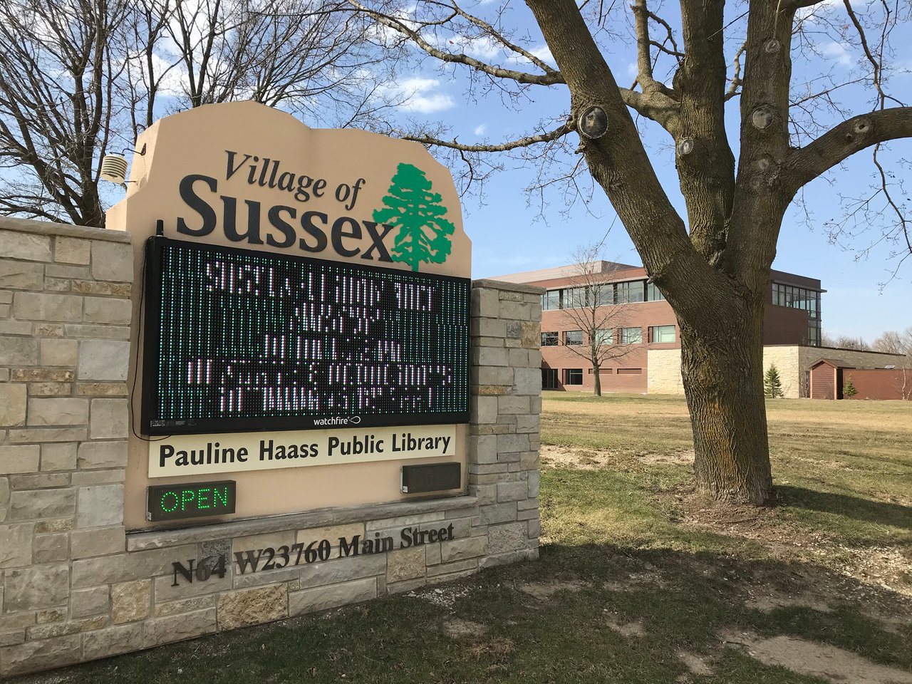 Village of Sussex sign in front of the Pauline Haass Public Library