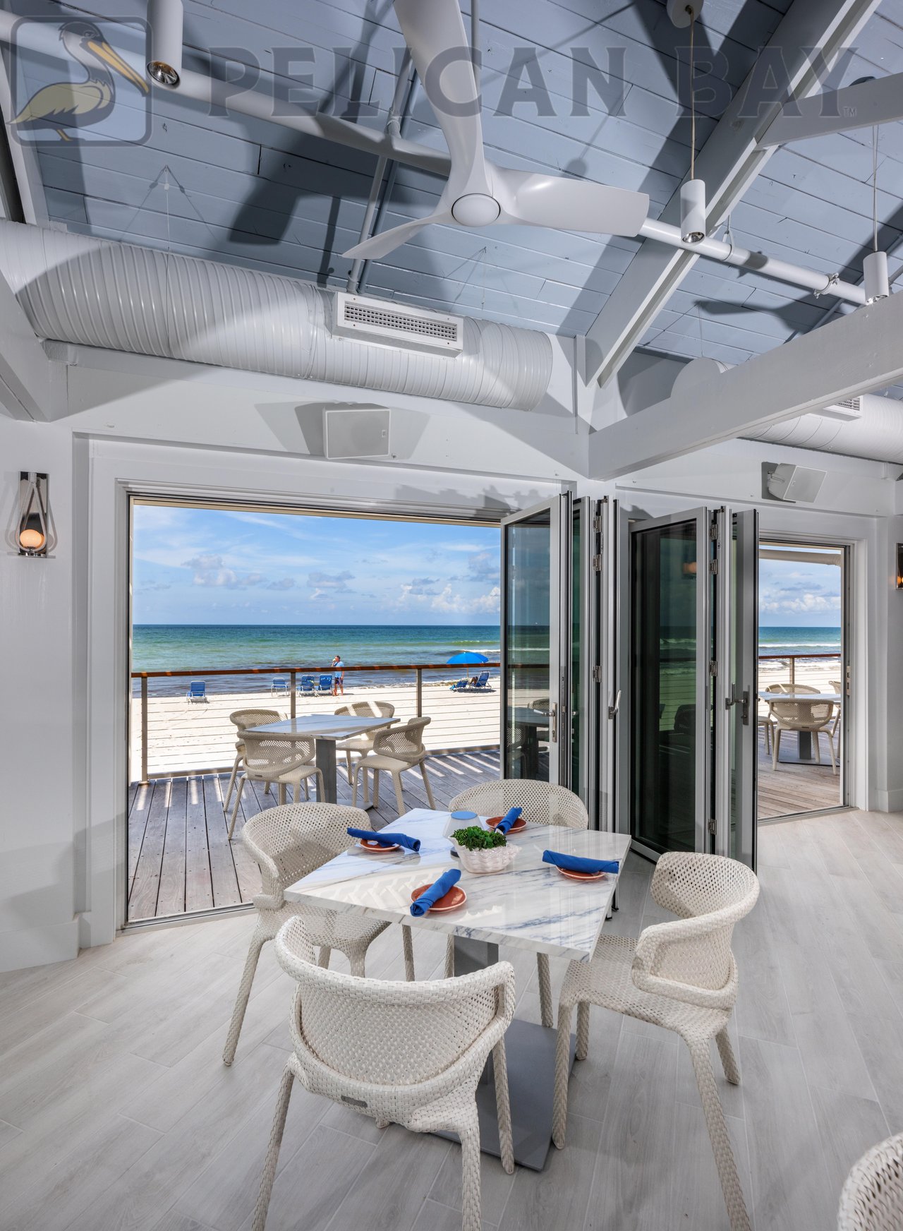 Open-air dining room at Sandbar restaurant in Pelican Bay Naples FL overlooking the Gulf