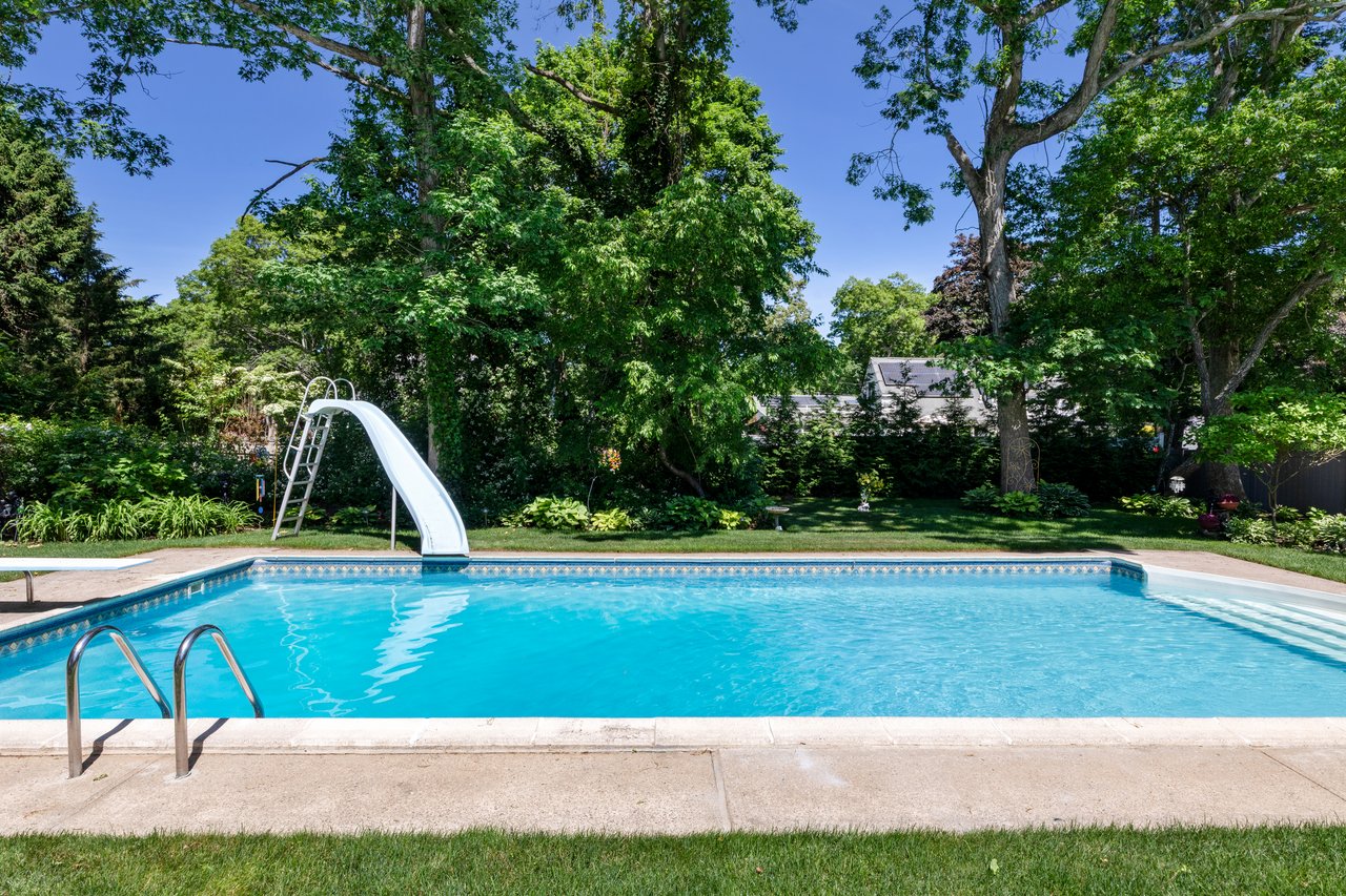 A Quiet Village Setting with a Pool at Its Center