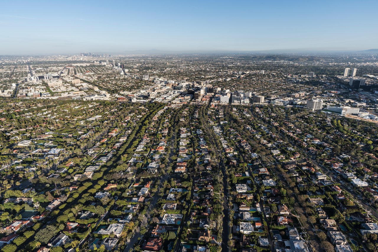 Aerial view of Mid-Wilshire, with tree-lined residential blocks and commercial buildings.