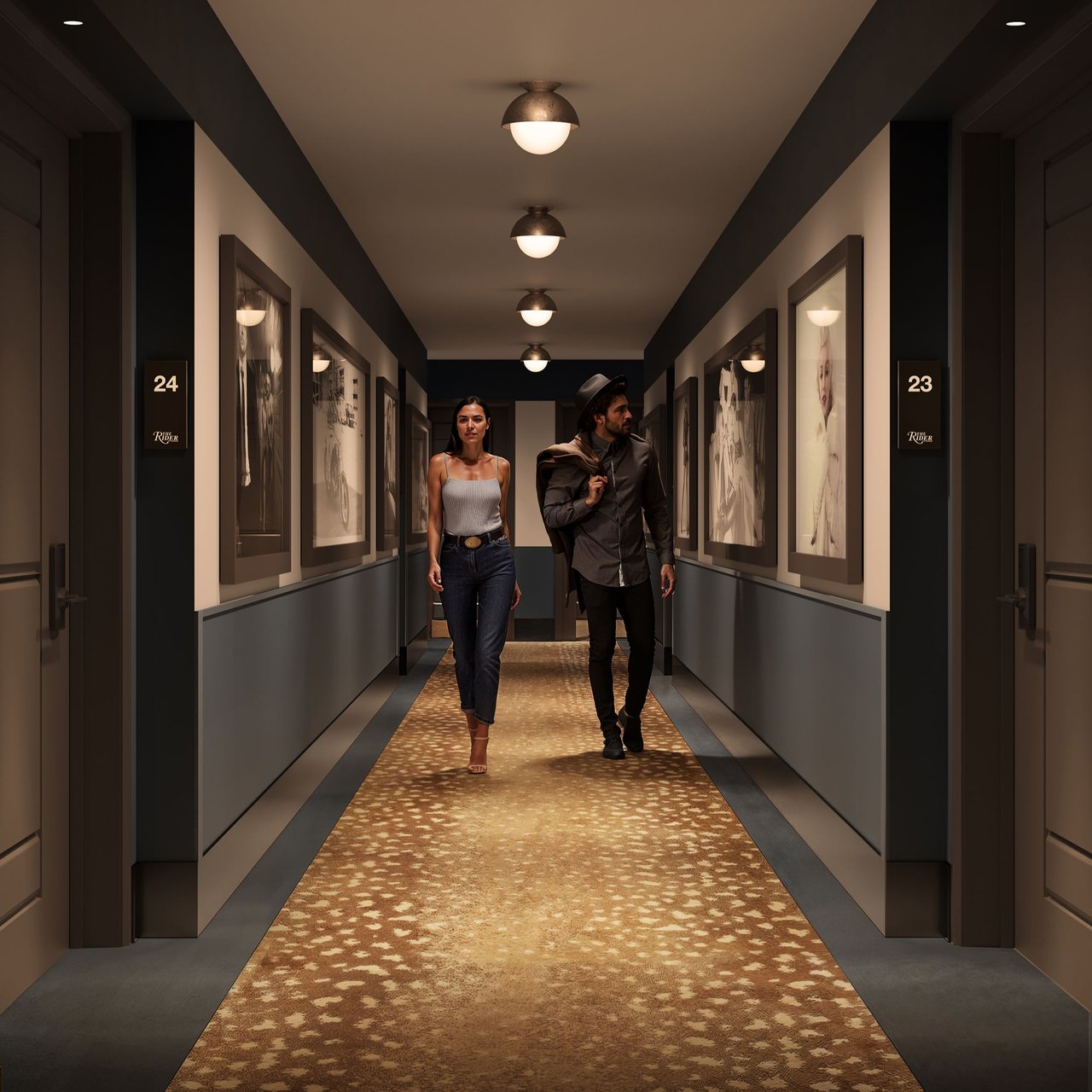 Residential hallway with framed artwork, patterned carpet, and two people walking between apartment doors.