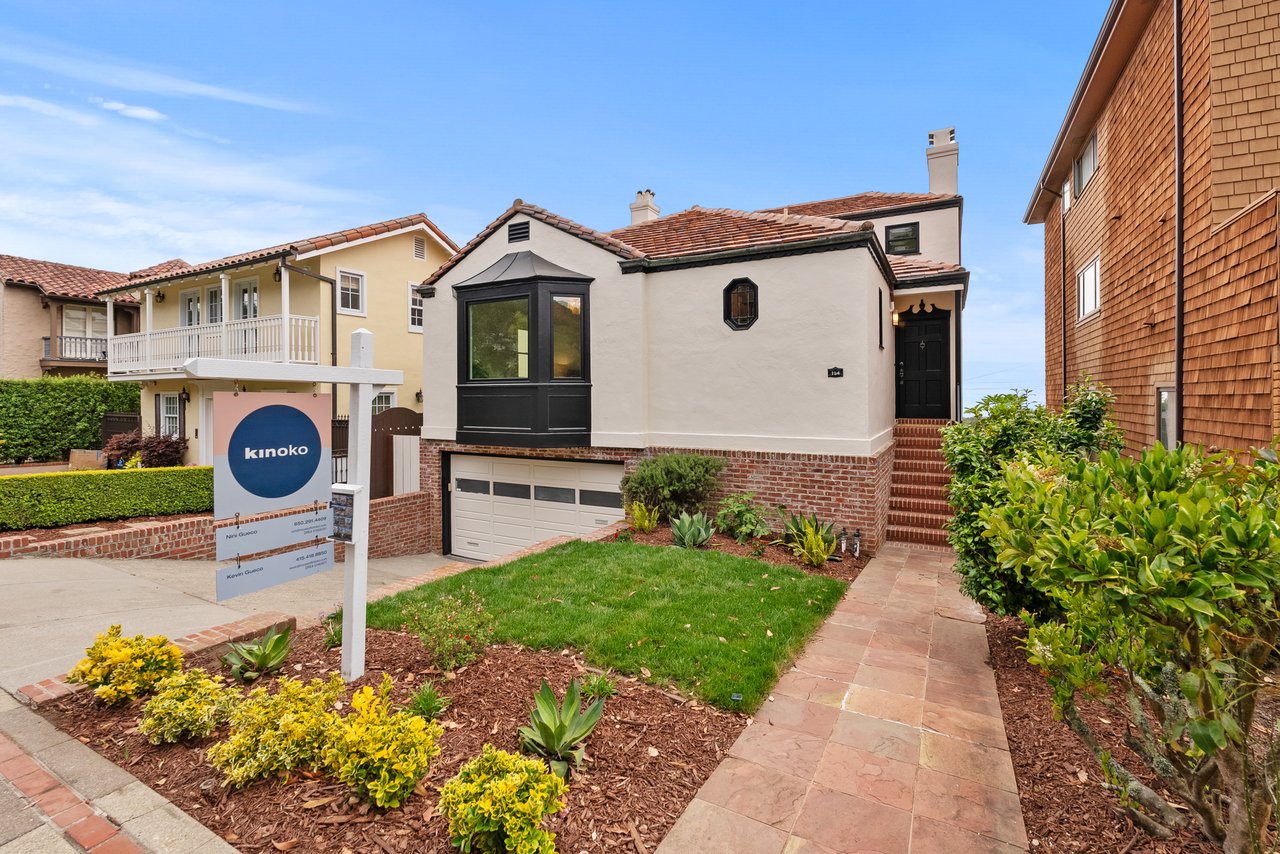 San Francisco home with landscaped yard and real estate for-sale sign