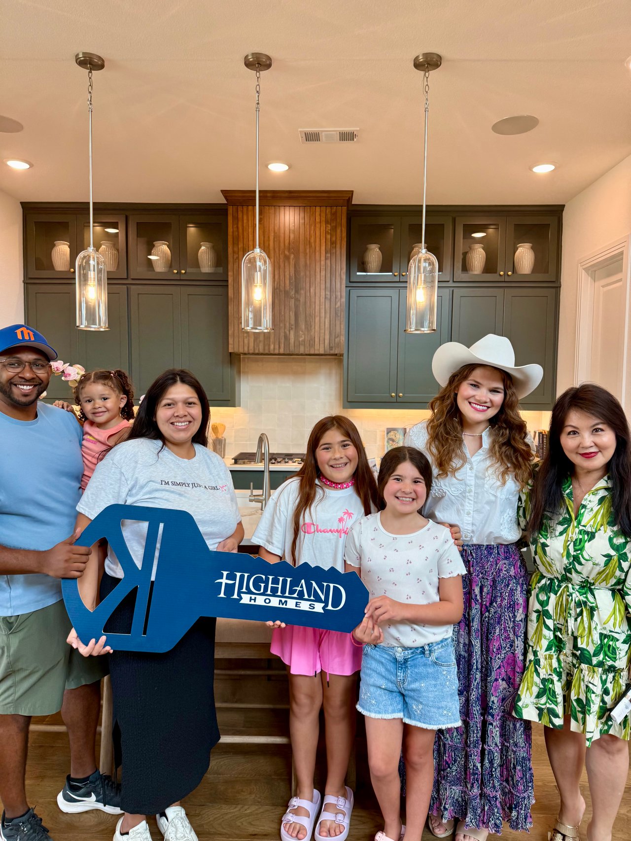 Bennett family and Miranda Realty Team at the Highland Homes model at Landmark by Hillwood in Denton, Texas, receiving keys to their brand new home