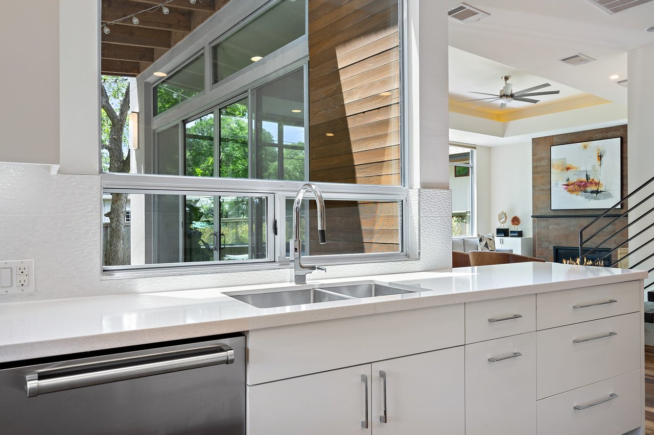 Kitchen sink area with a window view at 34 Margranita Crescent, Tarrytown, Austin, TX.