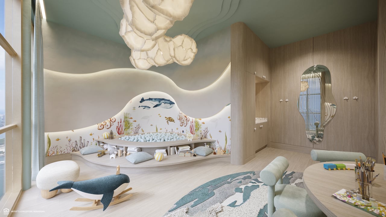 Children’s playroom with an ocean mural, built-in ball pit, and sculptural ceiling light.
