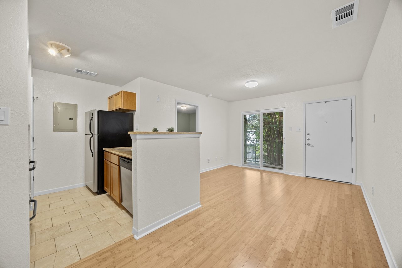 Top-Floor Condo Retreat in Gated Ivy Condos | Private Balcony + Tree-Filled Views