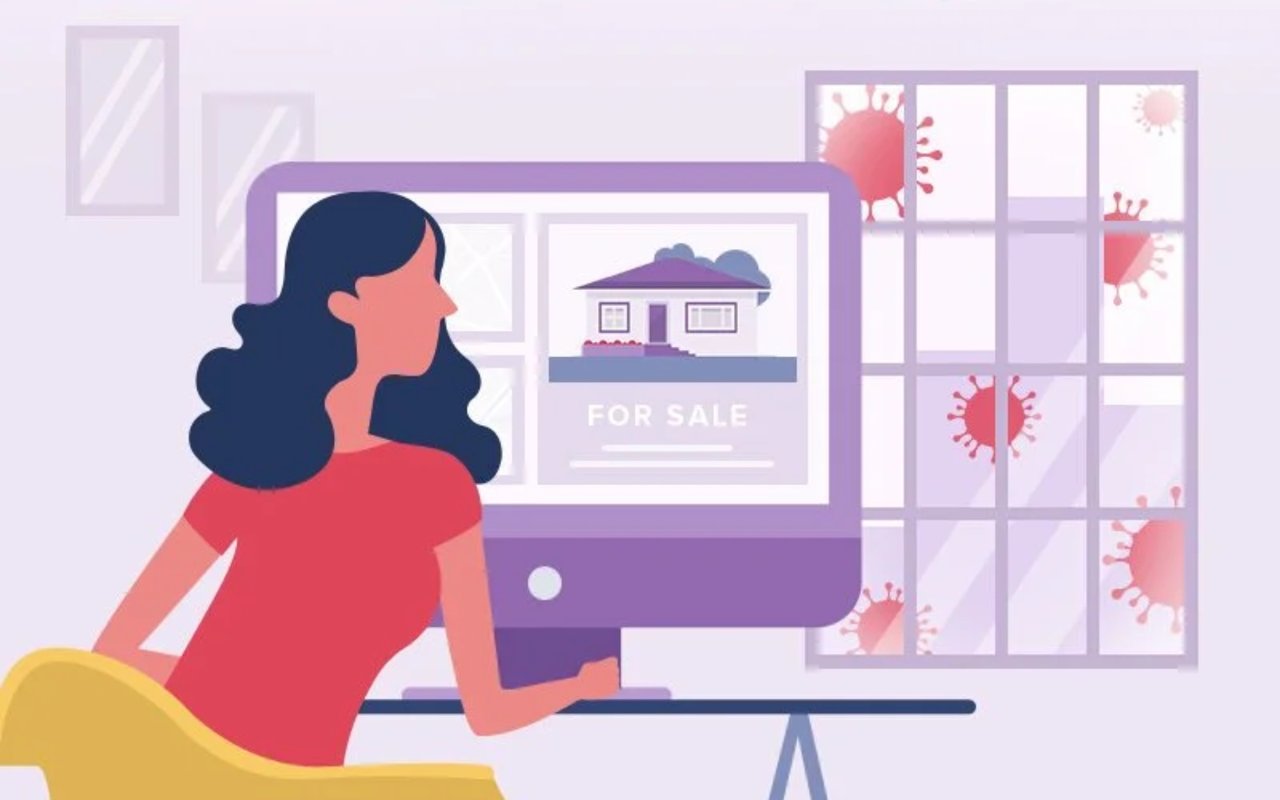 Woman views a home listing on a computer as coronavirus shapes appear outside the window.