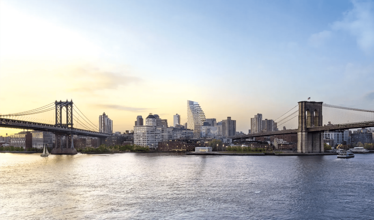 Brooklyn Bridge and Manhattan Bridge frame the DUMBO waterfront skyline across the East River at golden hour.