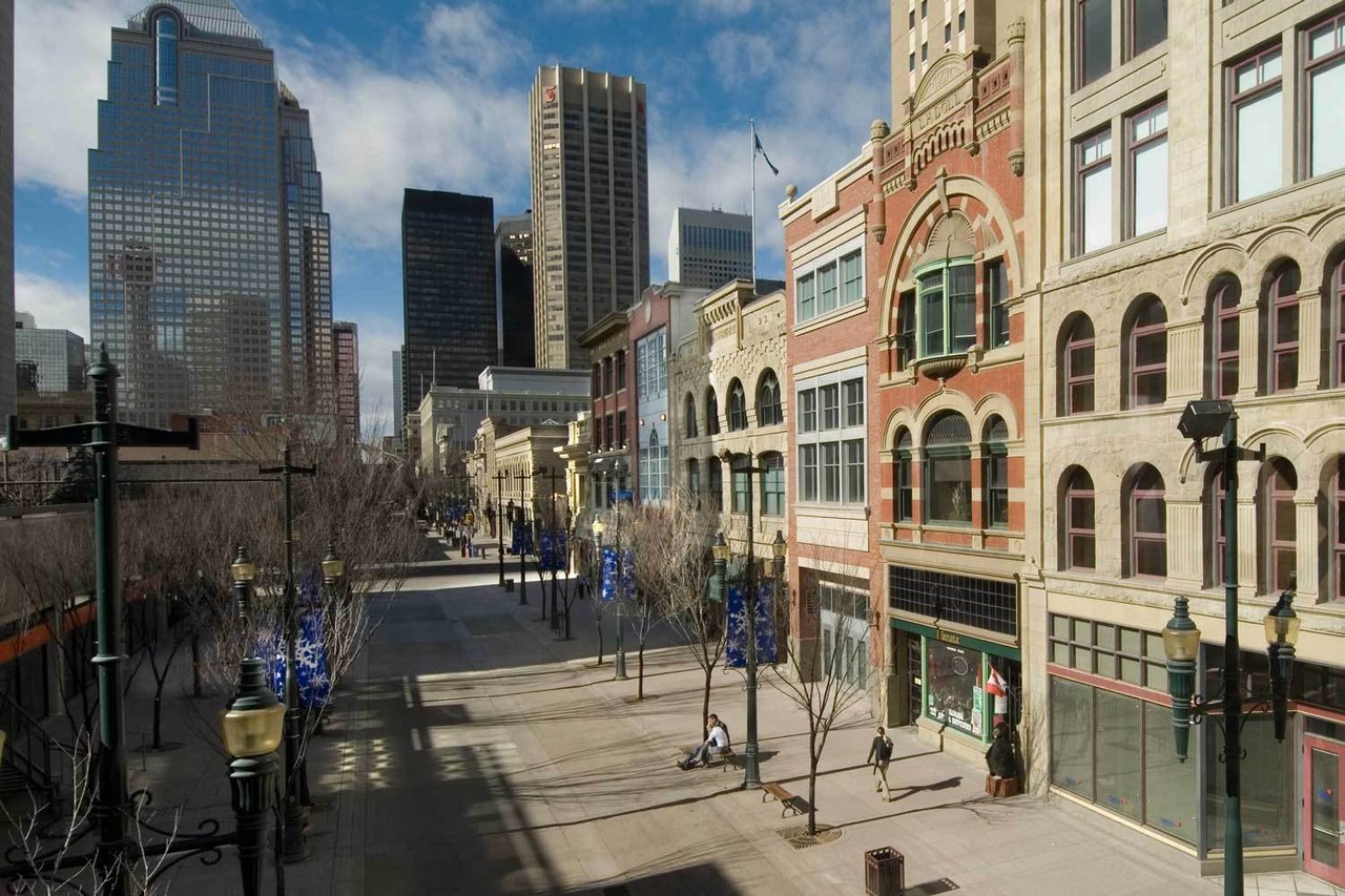 A dynamic streetscape featuring unique architecture and pedestrian-friendly blocks—ideal for conveying Kensington’s trendy, artsy feel.