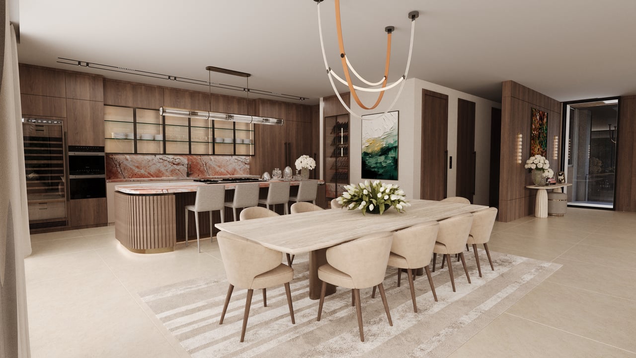 Open-plan dining room with a long pale table, upholstered chairs, and a curved kitchen island.