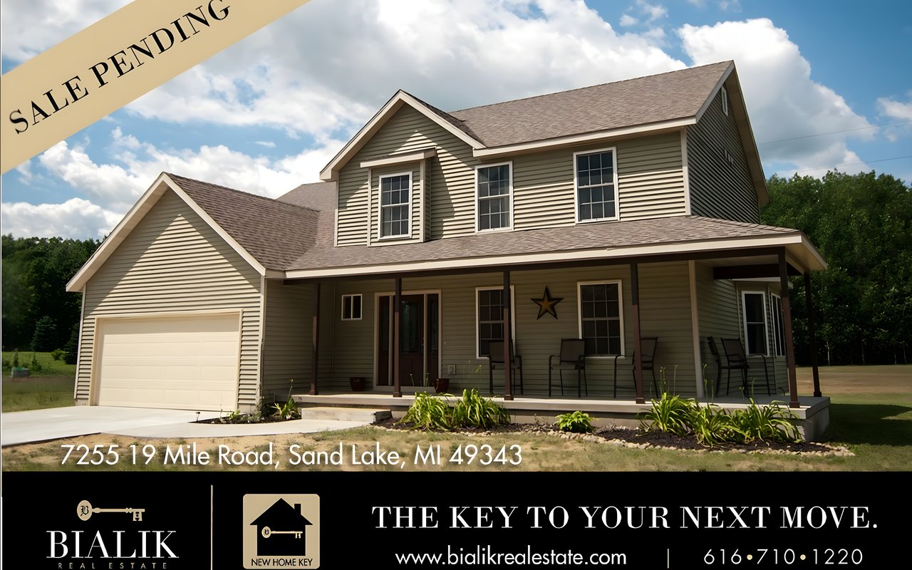 Two-story beige home with an attached garage and covered porch, marked sale pending.