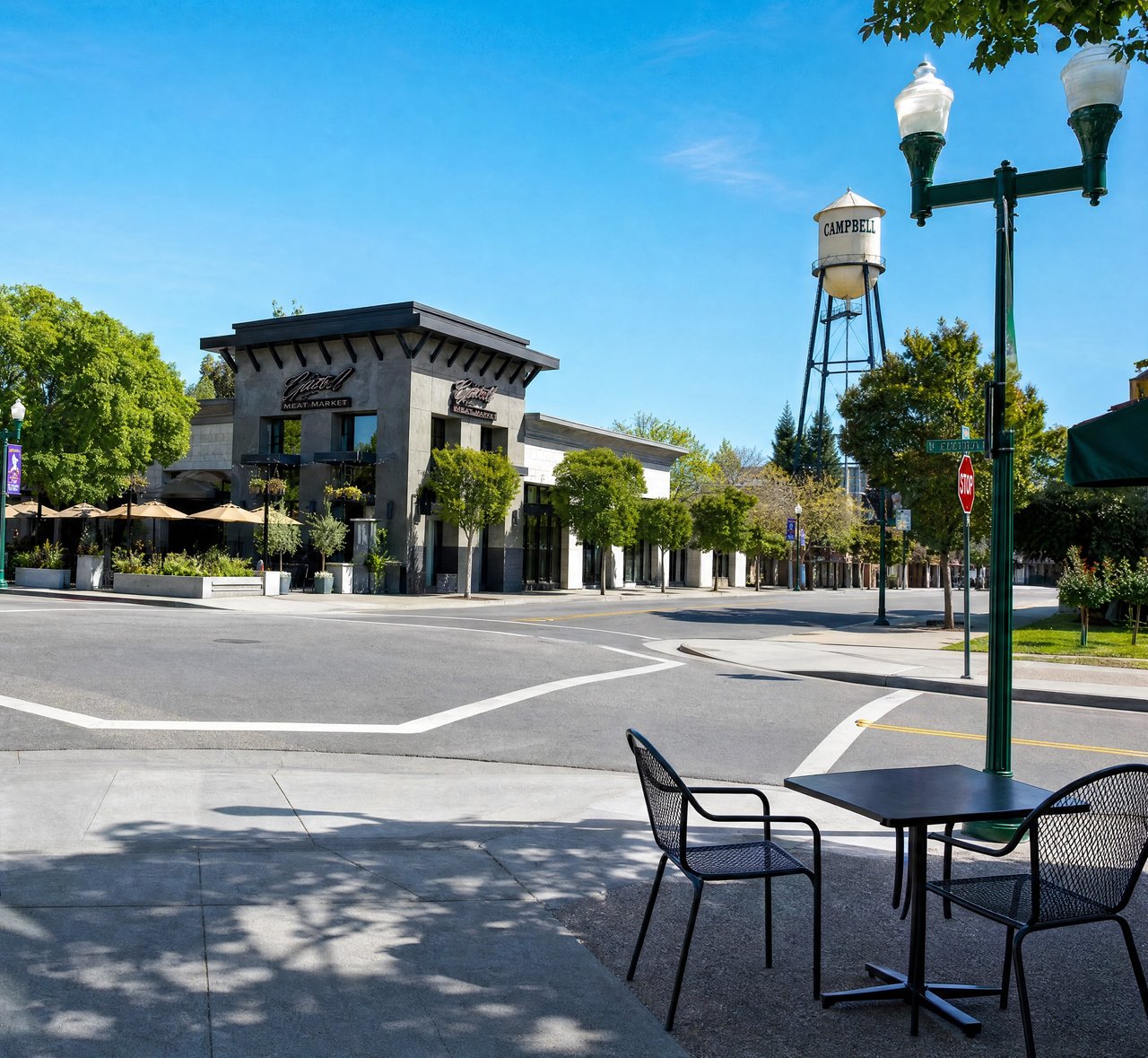 Campbell streetscape with outdoor restaurant seating and the Campbell water tower.