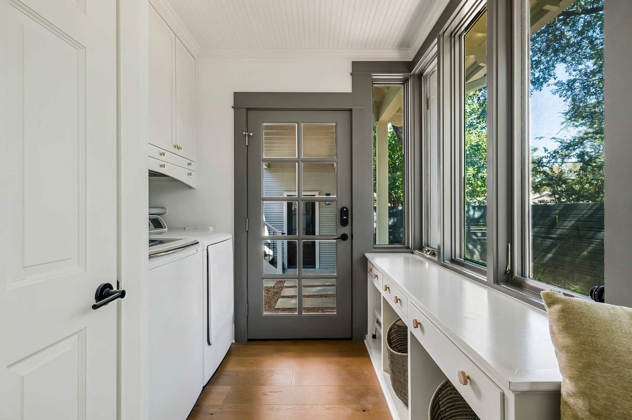 Laundry nook with built-in cabinetry at 1500 Northwood Rd, Pemberton Heights, Austin.