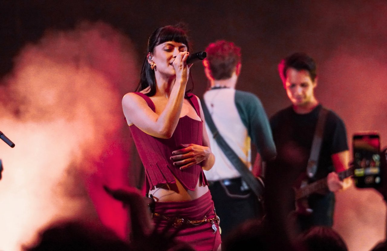 The Marias are performing on stage as a band. 