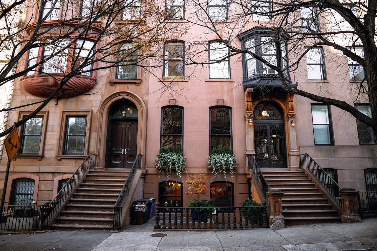 Historic townhouses, multifamily homes, mixed-use buildings, and boutique condominiums along St. Nicholas Avenue in Bushwick, Brooklyn.
