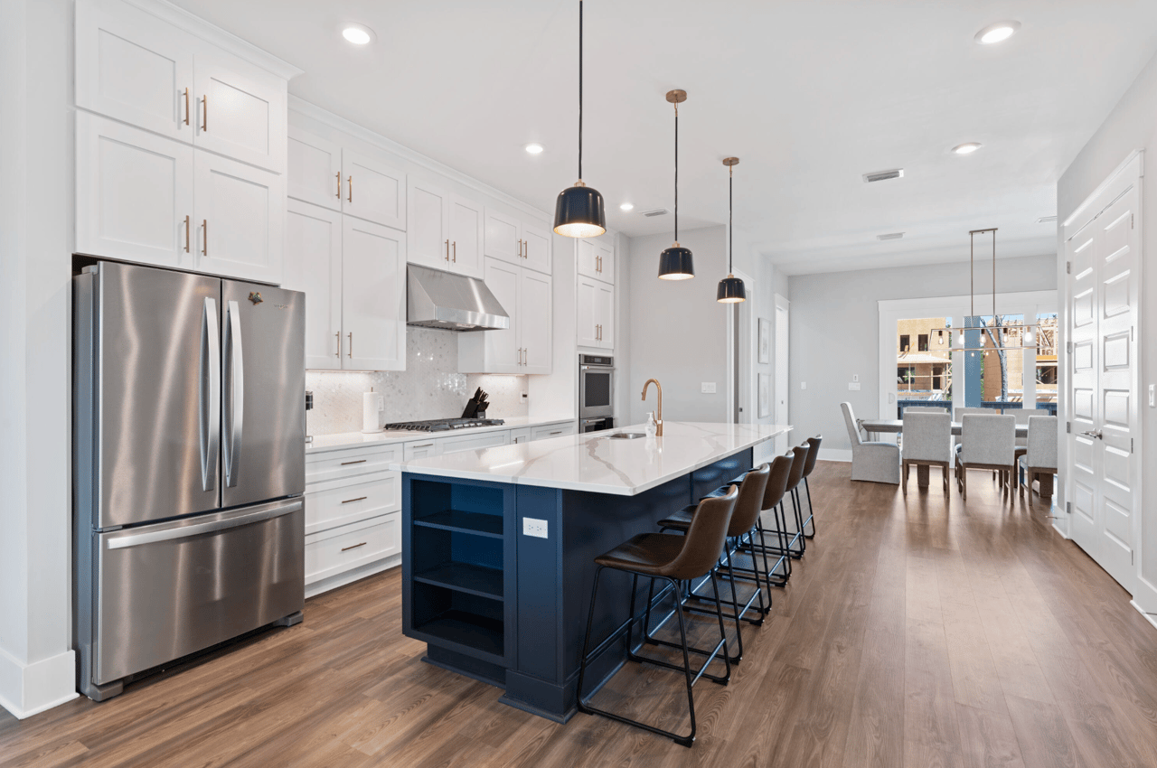 White Cabinets with Navy Blue Kitchen Island