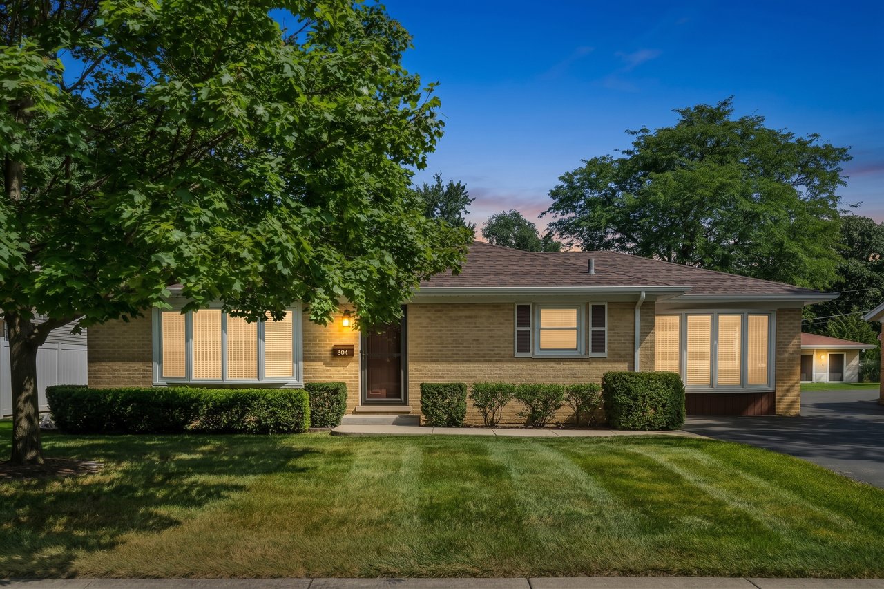 Twilight image of the home at 304 Crestwood Drive, Roselle, IL