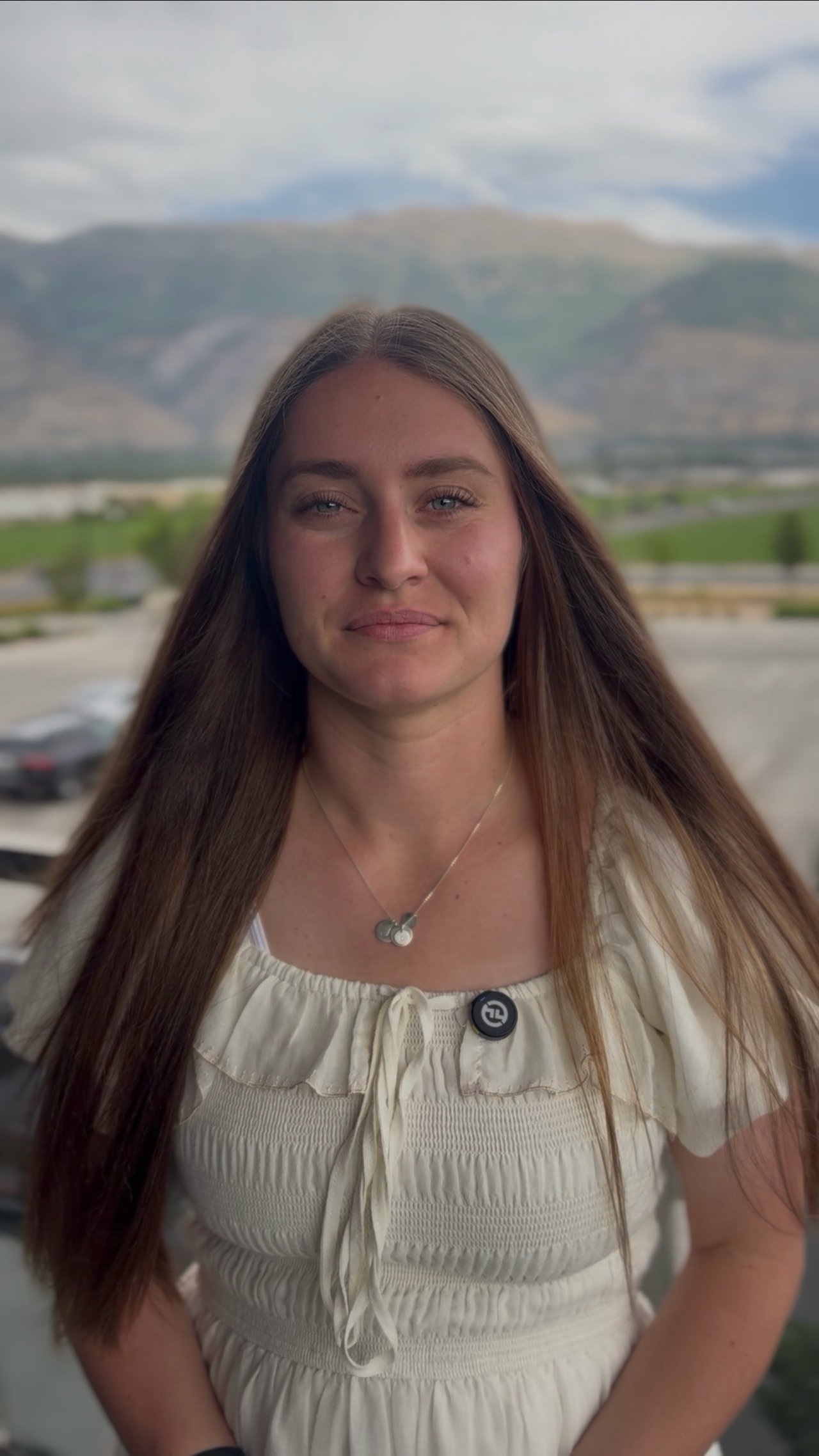 McKelle Siebert, founder of Foundry Group, smiling outdoors with the Wasatch Mountains in the background