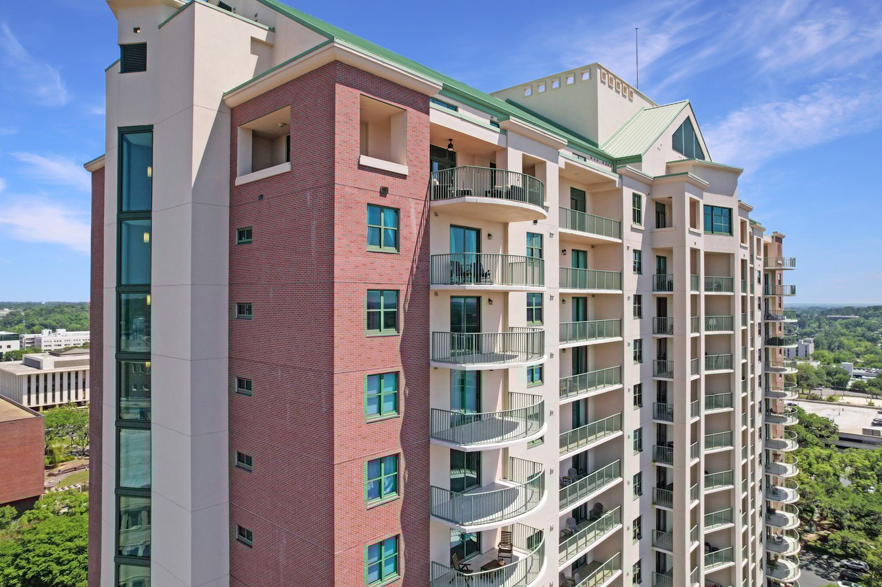 300 South Duval Street, Tallahassee, Florida 32303 Plaza Tower Drone Photo of exterior of the building featuring brick and glass accents and stunning views