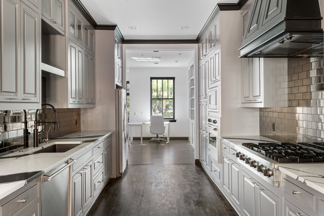 Galley style kitchen in NE 3rd street townhome at Maywood located in Deep Deuce Oklahoma City