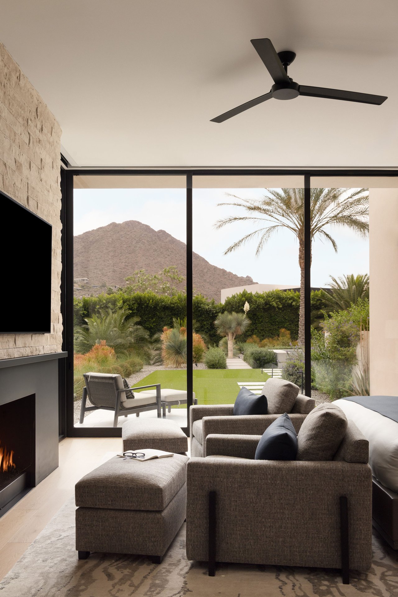 Modern luxury home in Paradise Valley with resort-style backyard, pool, fire feature, and contemporary architecture at sunset.
