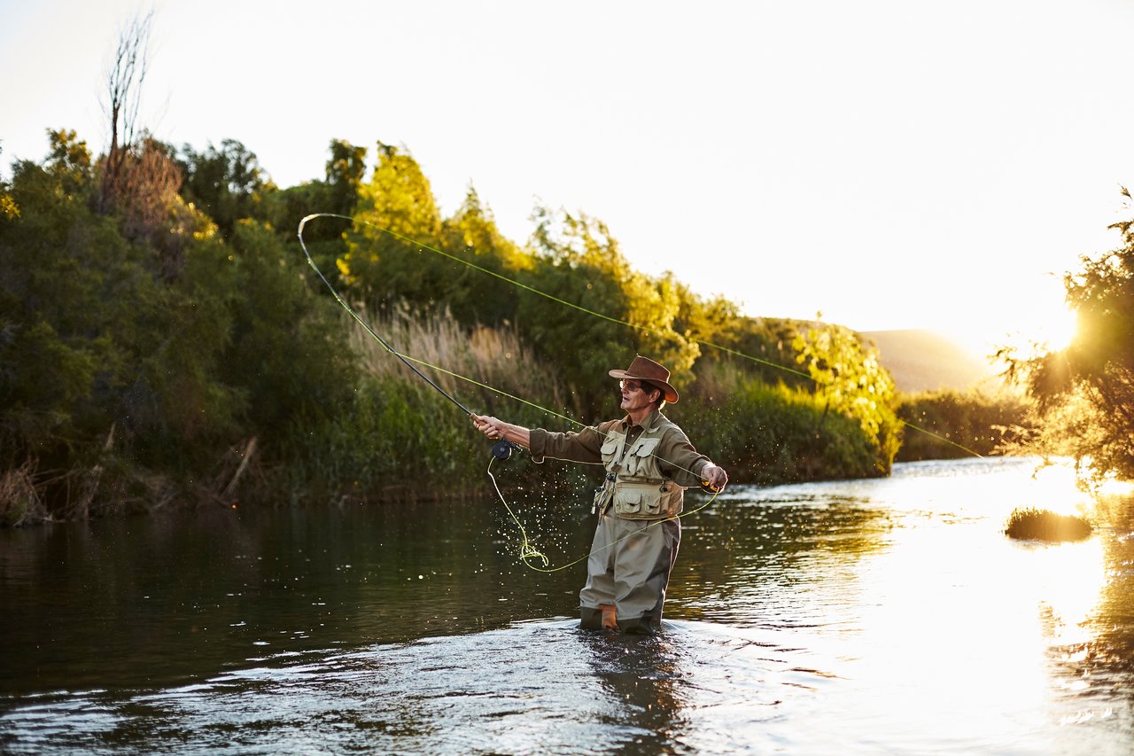 Fly fisherman enjoying one of the many rivers and streams near Franklin, North Carolina and River Green Condominiums.