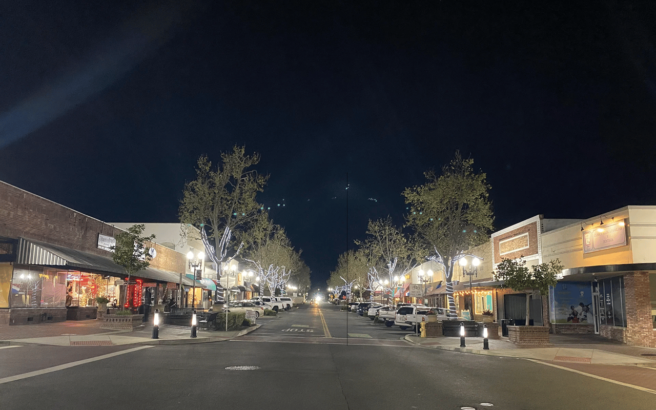 Historic Main Street in Downtown Lake Elsinore, CA, decorated with street lights at night.