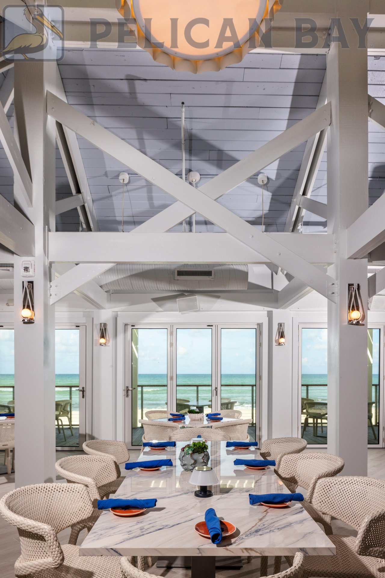 ight-filled dining area with vaulted ceilings at Sandbar beachfront restaurant in Pelican Bay Naples