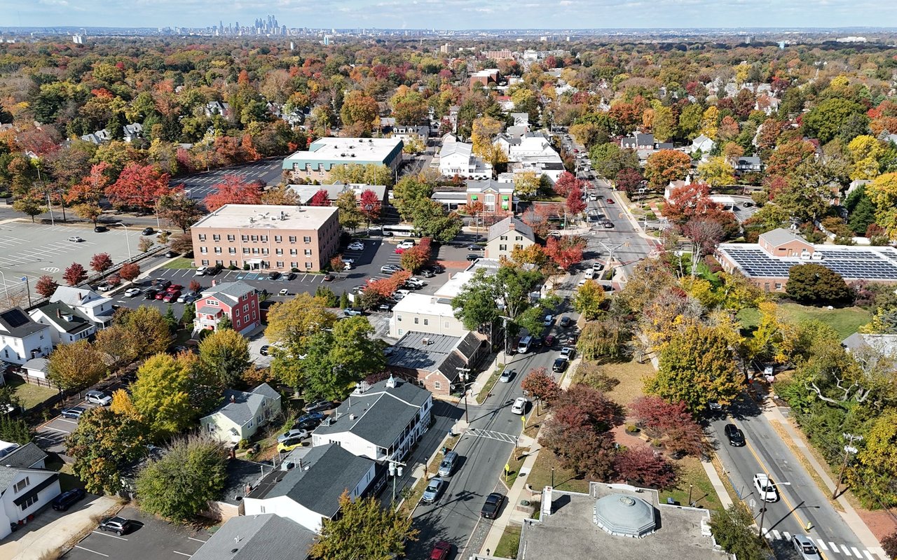 Aerial view of Haddonfield in autumn, with the Philadelphia skyline in the distance.