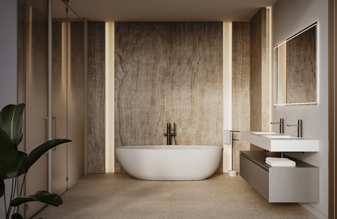Luxury bathroom with a freestanding soaking tub, textured stone wall, and double vanity.