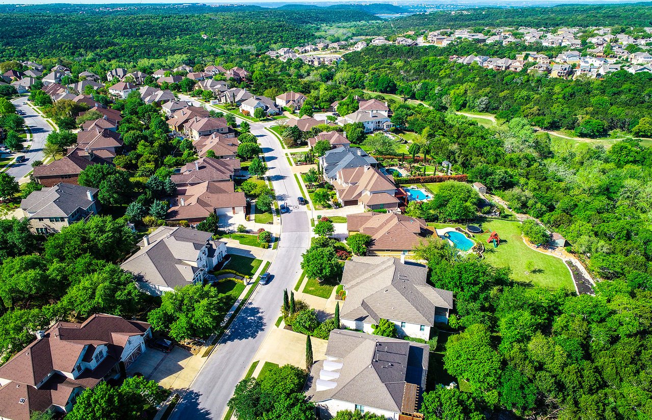 Cedar Park Texas mature neighborhood street with trees and homes