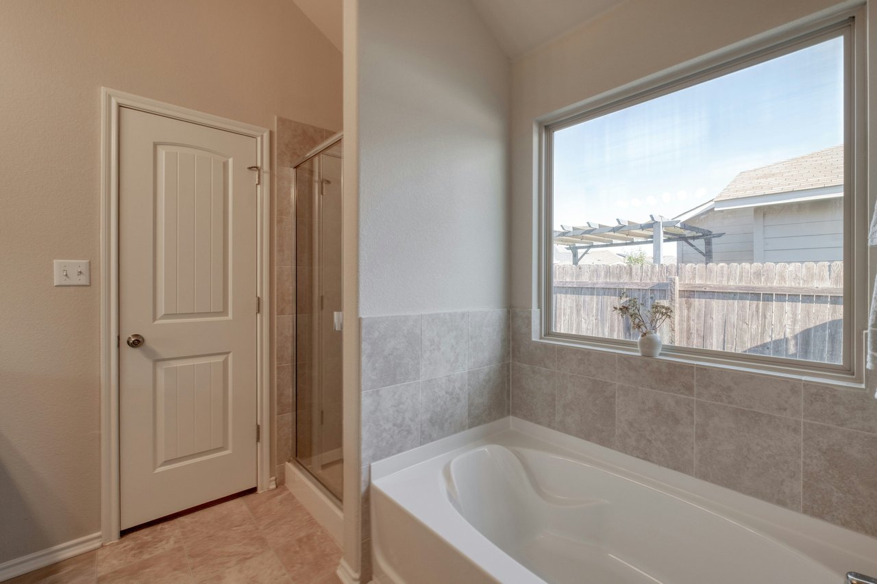 Rare Cul-de-Sac Gem in Manor – With No Neighbor on One Side and Access to HOA-owned Greenspace Right Outside Your Doorstep!