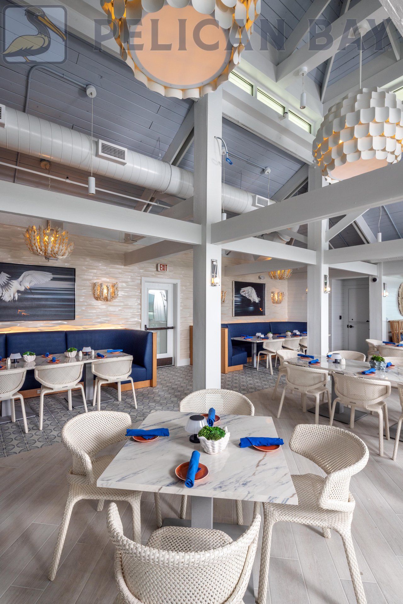 Coastal-inspired interior of Sandbar beachfront restaurant in Pelican Bay Naples FL with modern decor and ocean views