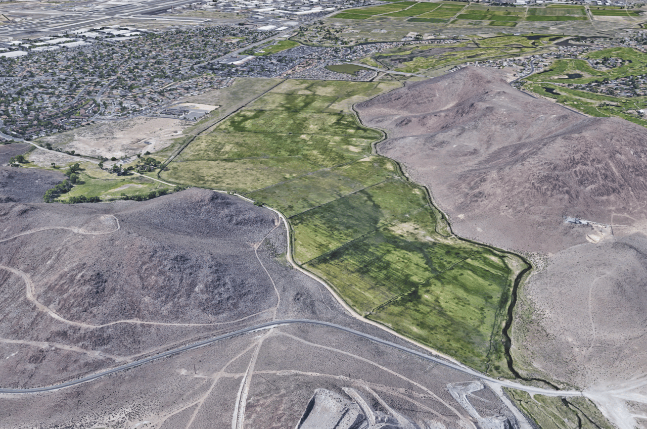 Overview of the Talus Valley master-planned community in South Reno, Nevada, featuring new homes and surrounding development