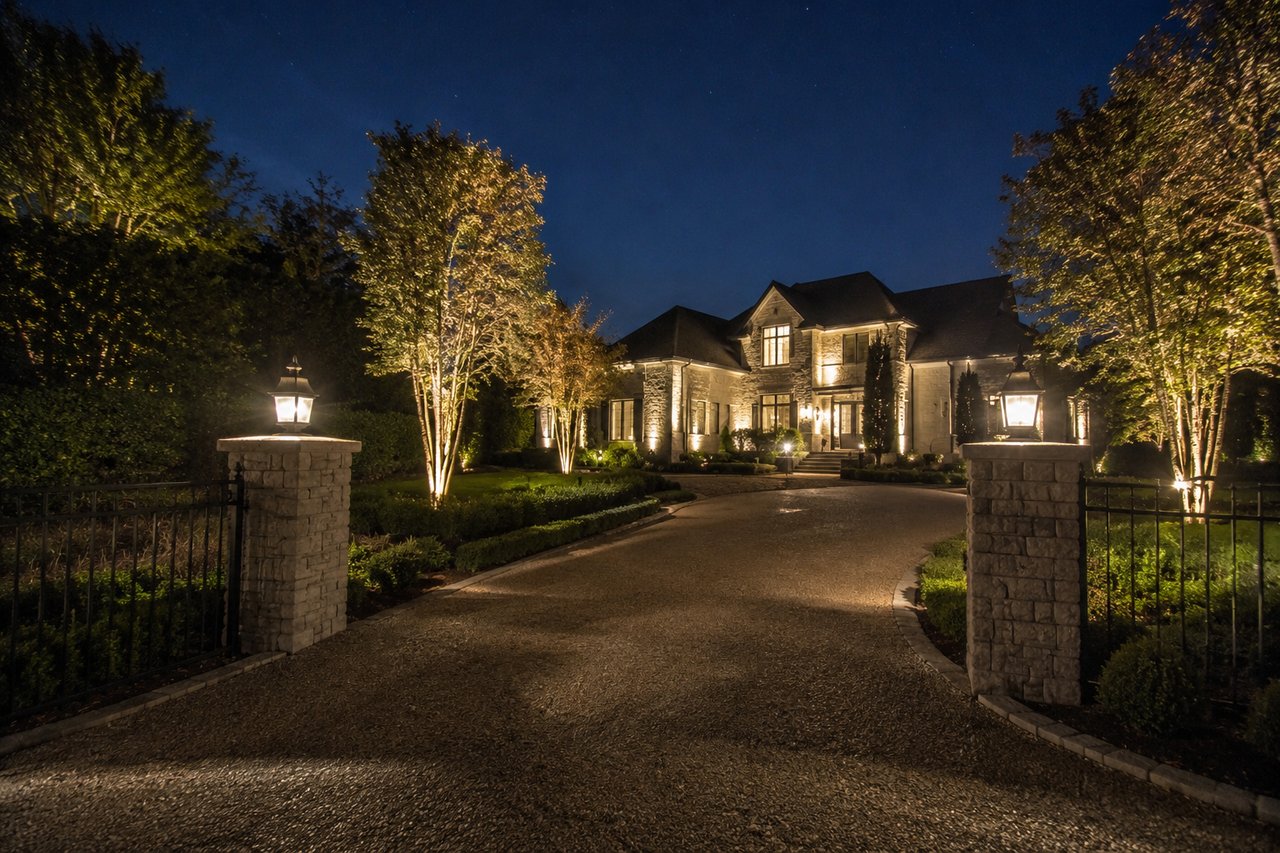 Serene driveway to a grand mansion in Nashville by Morrell Property Collective