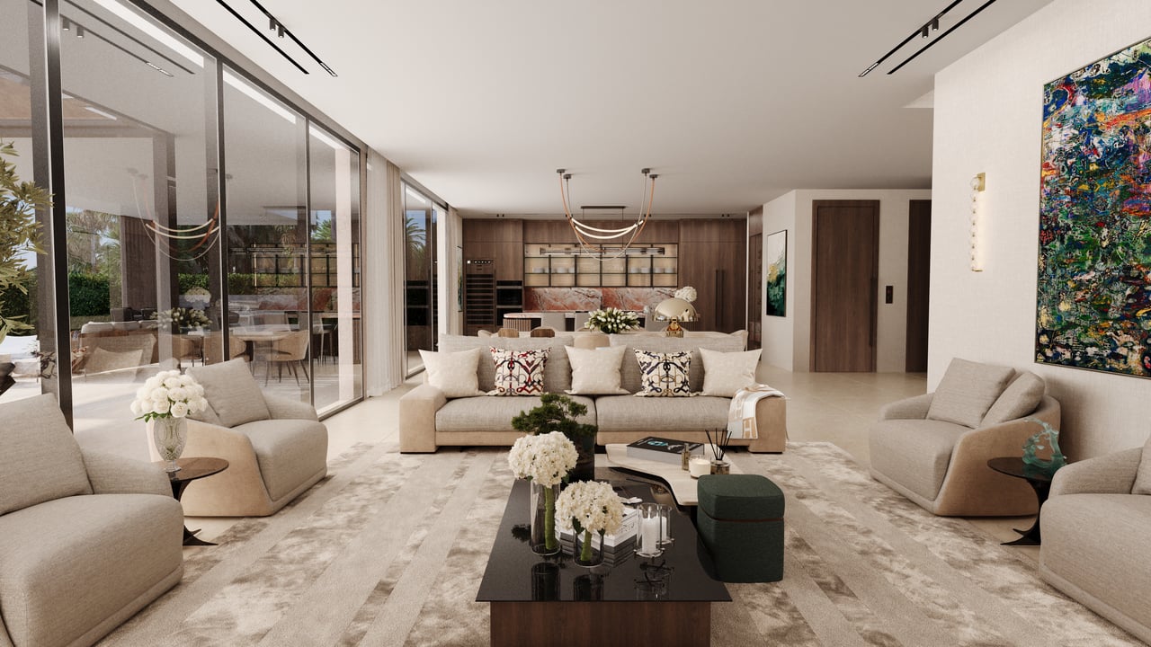 Open-plan living room with floor-to-ceiling glass doors, neutral sofas, and the kitchen in the background.