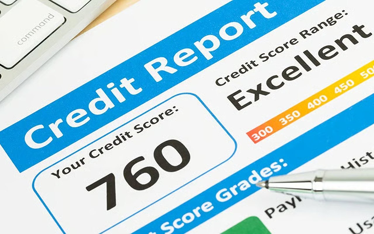 Credit report showing a score of 760 rated Excellent, with a pen near the score grades.