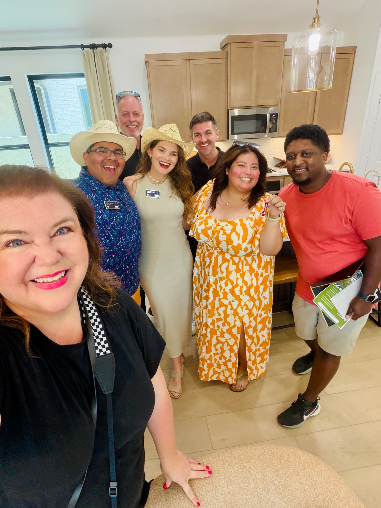 Sinclair's celebrating their closing day in the M/I Homes model kitchen at Landmark by Hillwood with Miranda Realty Team, Hillwood Community Lifestyle Manager Page Austin, and HOA Community Manager Tim Mills on June 29, 2026