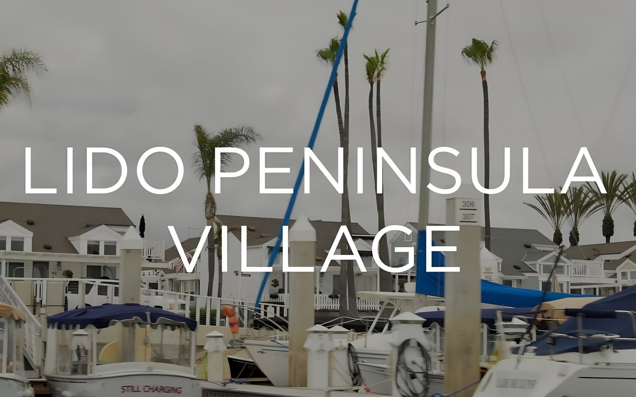 An aerial view of the Lido Peninsula Village neighborhood, with homes and the ocean in the background.