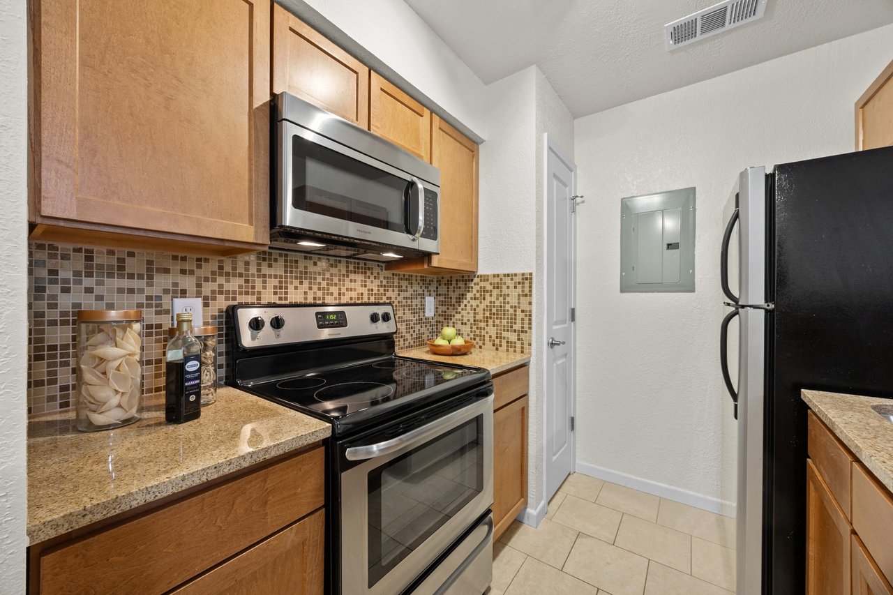 Top-Floor Condo Retreat in Gated Ivy Condos | Private Balcony + Tree-Filled Views