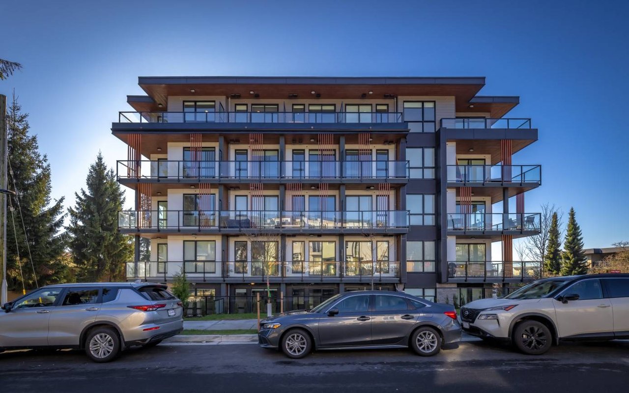 Bay Area multifamily broker reviewing apartment building financials with a property owner