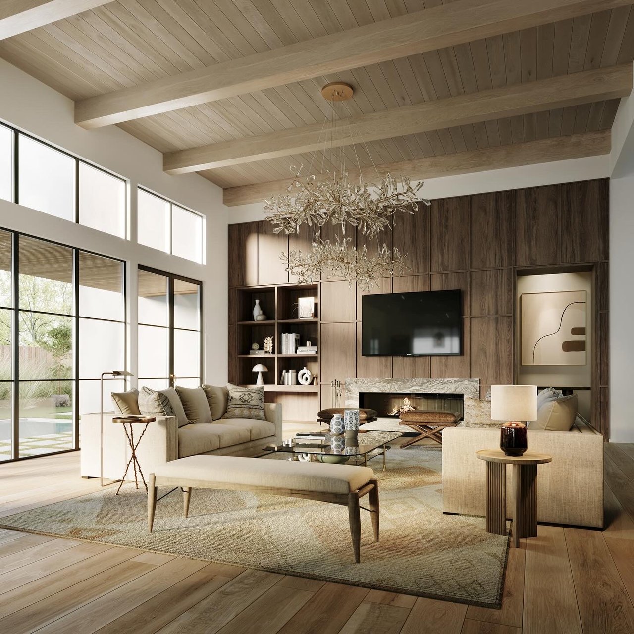 Modern living room with vaulted ceilings, wooden shelves, marble fireplace, and a neutral seating area