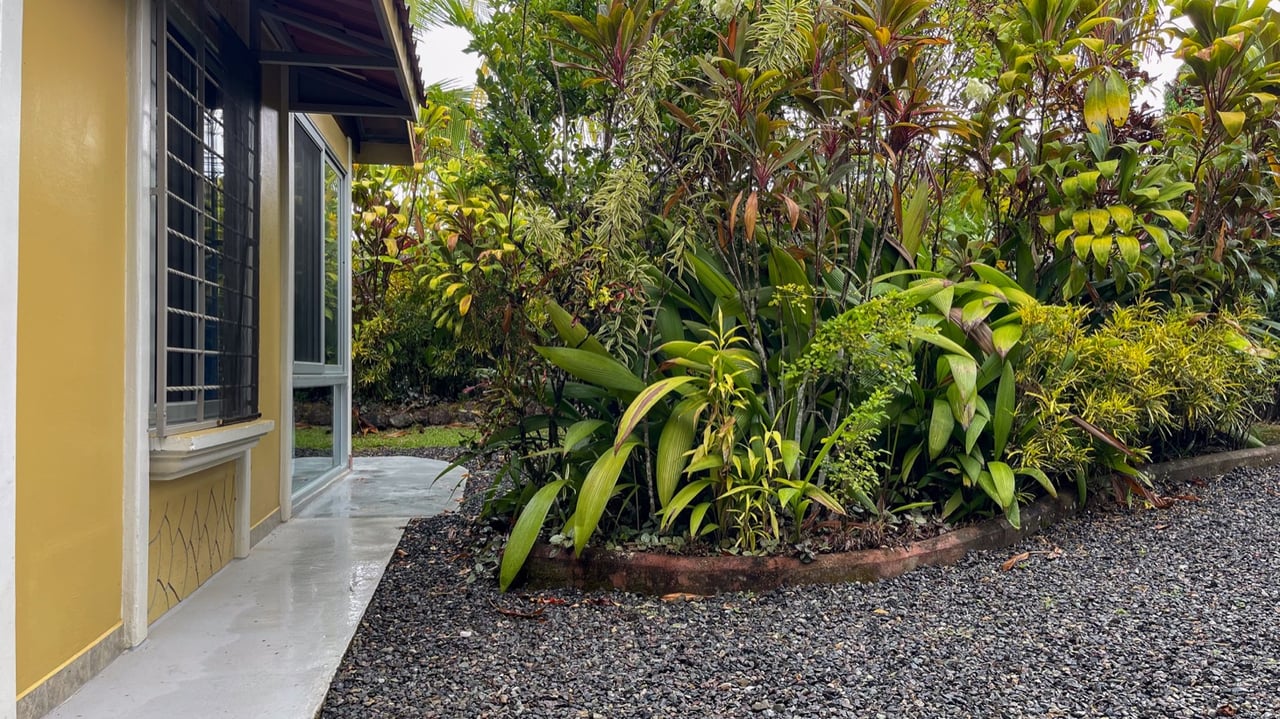 Cozy Colonial Home with Lush Gardens and Prime Commercial Prospects