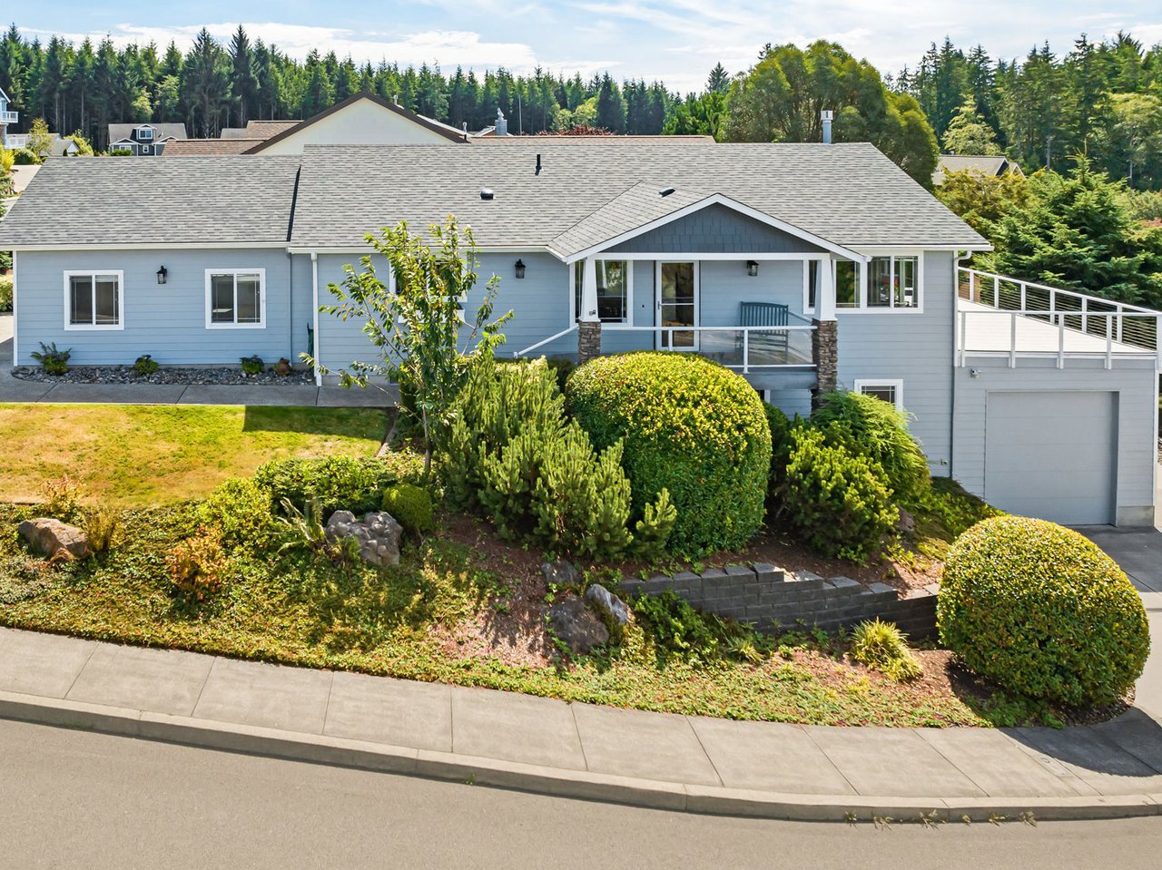 Sold elevated Seaside Oregon home at 2065 Cooper Dr with ocean and Tillamook Head views