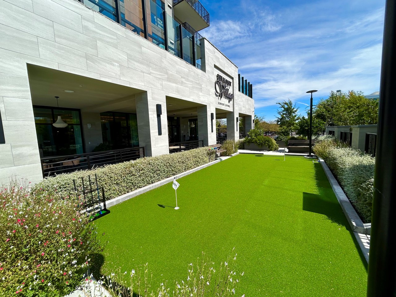 "Outdoor putting green outside Belmont Village San Ramon senior living community"